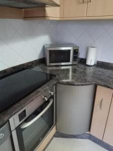 A kitchen or kitchenette at EL RINCON DE LUZ