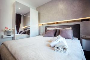 Posteľ alebo postele v izbe v ubytovaní Citylux Apartments