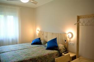 Postel nebo postele na pokoji v ubytování B&B LOS LLANOS