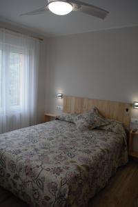 Postel nebo postele na pokoji v ubytování B&B LOS LLANOS