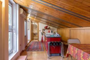 a small room with a red counter in a house at Gheller Apartment in Verona