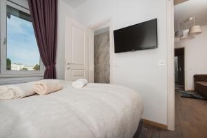 Posteľ alebo postele v izbe v ubytovaní Citylux Apartments