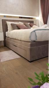 Posteľ alebo postele v izbe v ubytovaní Citylux Apartments