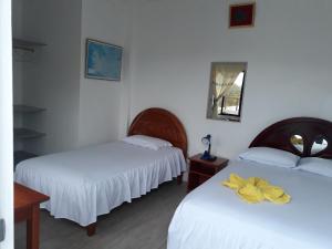 Voodi või voodid majutusasutuse Hostal Insular toas