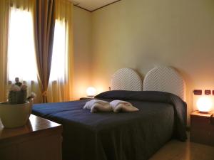 Säng eller sängar i ett rum på Torreata Hotel & Residence