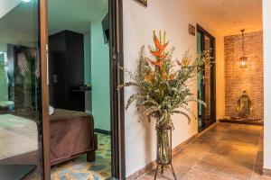 Voodi või voodid majutusasutuse Hotel Alamos Del Parque toas