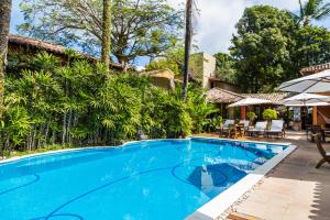 A piscina localizada em Hotel Pousada Coqueiros ou nos arredores