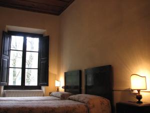 Łóżko lub łóżka w pokoju w obiekcie Locanda Dei Baroni - Antica Dimora