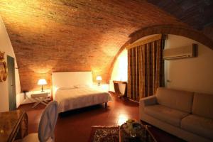 Postel nebo postele na pokoji v ubytování Sangallo Hotel