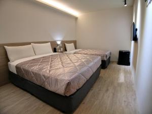 Postel nebo postele na pokoji v ubytování Chance Hotel