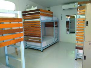A bunk bed or bunk beds in a room at Hey beach hostel-SHA Extra Plus
