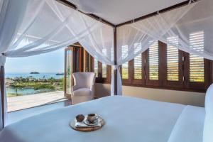 Кровать или кровати в номере Six Senses Fiji