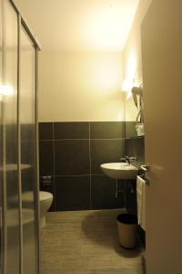 Koupelna v ubytování Hotel Cecco