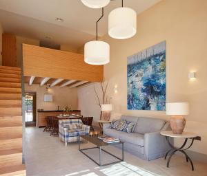 a living room with a couch and a table at Trafalgar Polo Club in El Palmar