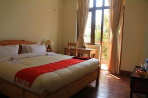 Letto o letti in una camera di ROKPA Guest House