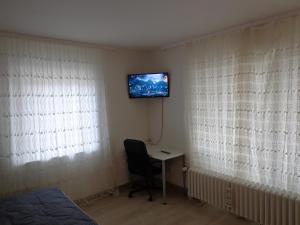 Apartments Nähe Messe Laatzen-Gleidingen - room agencyにあるテレビまたはエンターテインメントセンター