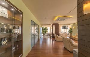 a lobby of a hotel with couches and a bar at Atrion Resort Hotel in Agia Marina Nea Kydonias