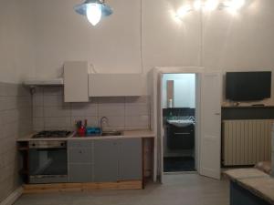 a small kitchen with a stove and a sink at Cardano in Pavia
