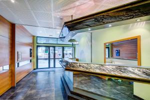a bar in a restaurant with a counter at Vacancéole - Résidence Illixon in Luchon
