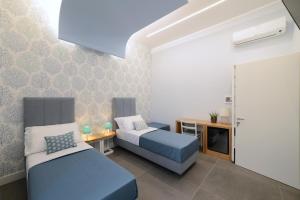 Posteľ alebo postele v izbe v ubytovaní In Centro B&B