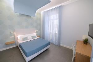 Posteľ alebo postele v izbe v ubytovaní In Centro B&B
