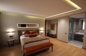 Postel nebo postele na pokoji v ubytování Nobel Hotel