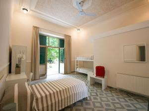 Кровать или кровати в номере Ostello San Luigi Orione