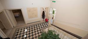 Кровать или кровати в номере Ostello San Luigi Orione