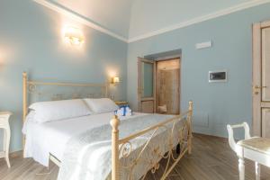 Postel nebo postele na pokoji v ubytování Le torri di Tarquinia