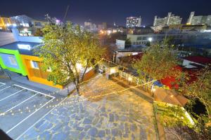 an overhead view of a city at night with lights at With U Hotel & Guesthouse in Sokcho