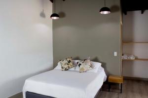 Postel nebo postele na pokoji v ubytování Hotel Boutique Plaza