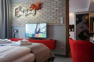 Łóżko lub łóżka w pokoju w obiekcie AGA Tenis Apartments by Radwańska