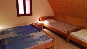 Postel nebo postele na pokoji v ubytování Chaty u rybníka Brodský