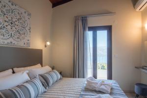 A bed or beds in a room at Istros Villas, infinite blue, By ThinkVilla