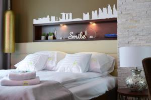 Łóżko lub łóżka w pokoju w obiekcie AGA Tenis Apartments by Radwańska