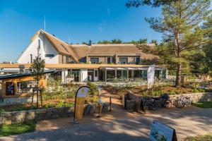 a house with a lot of bikes parked in front of it at Düne 74 in Karlshagen