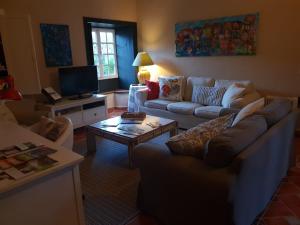 a living room with a couch and a coffee table at Casita del Medianero in Santa Cruz de la Palma