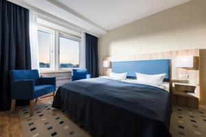 Ein Bett oder Betten in einem Zimmer der Unterkunft Baltic Zinnowitz - Hotel mit Meerwasserpool und Thermalbad
