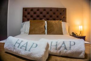 Voodi või voodid majutusasutuse Hotel Alamos Del Parque toas