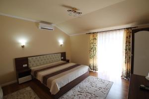 Postel nebo postele na pokoji v ubytování Casa Camelia Felix