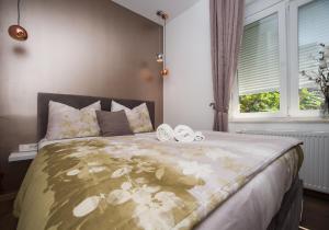 Posteľ alebo postele v izbe v ubytovaní Citylux Apartments