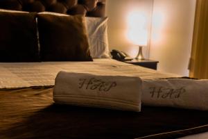 Voodi või voodid majutusasutuse Hotel Alamos Del Parque toas