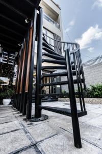 a spiral staircase in front of a building at Homestay Villa Full House in Ha Long