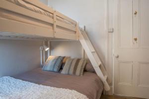 Двухъярусная кровать или двухъярусные кровати в номере Country Nest