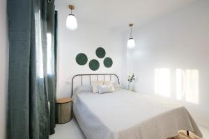 Posteľ alebo postele v izbe v ubytovaní tuGuest Placeta de San Gil Apartments