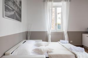 En eller flere senger på et rom på A World Aparts - 105 Pellegrino