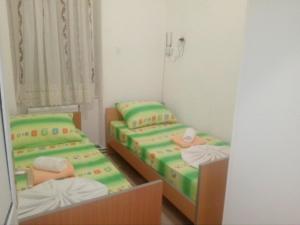 Ένα ή περισσότερα κρεβάτια σε δωμάτιο στο Hostel Corner 021