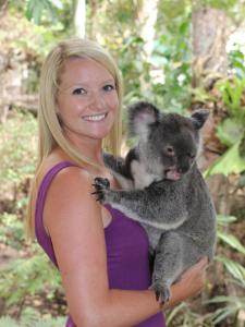 a woman holding a koala in her arms at Caversham B&B in Perth