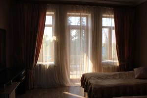 Llit o llits en una habitació de Ivanovka Guest House