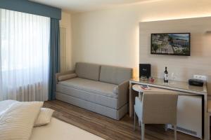 Televiisor ja/või meelelahutuskeskus majutusasutuses Hotel Campione